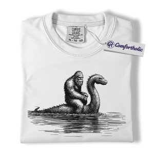 Alternative view of Bigfoot and Loch Ness Monster Shirt, Funny Cryptid T-Shirt, Sasquatch Riding Nessie Graphic Tee, Mythical Creature Gift, Funny Monster Comfort Colors Shirt