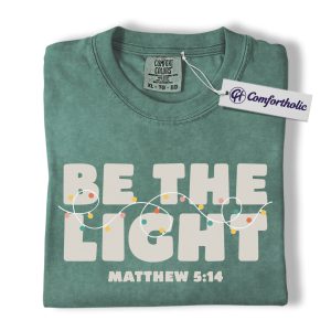Be The Light Shirt, Christian Christmas T-Shirt, Matthew 5:14 Bible Verse Graphic Tee, Faith-Based Holiday Gift for Believers, Christmas Comfort Colors Shirt