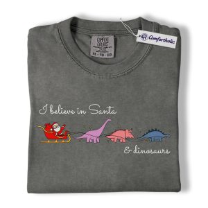 I Believe in Santa and Dinosaurs Shirt, Funny Dinosaur Christmas T-Shirt, Cute Santa Dino Graphic Tee, Whimsical Holiday Gift for Dinosaur Lovers, Christmas Comfort Colors Shirt
